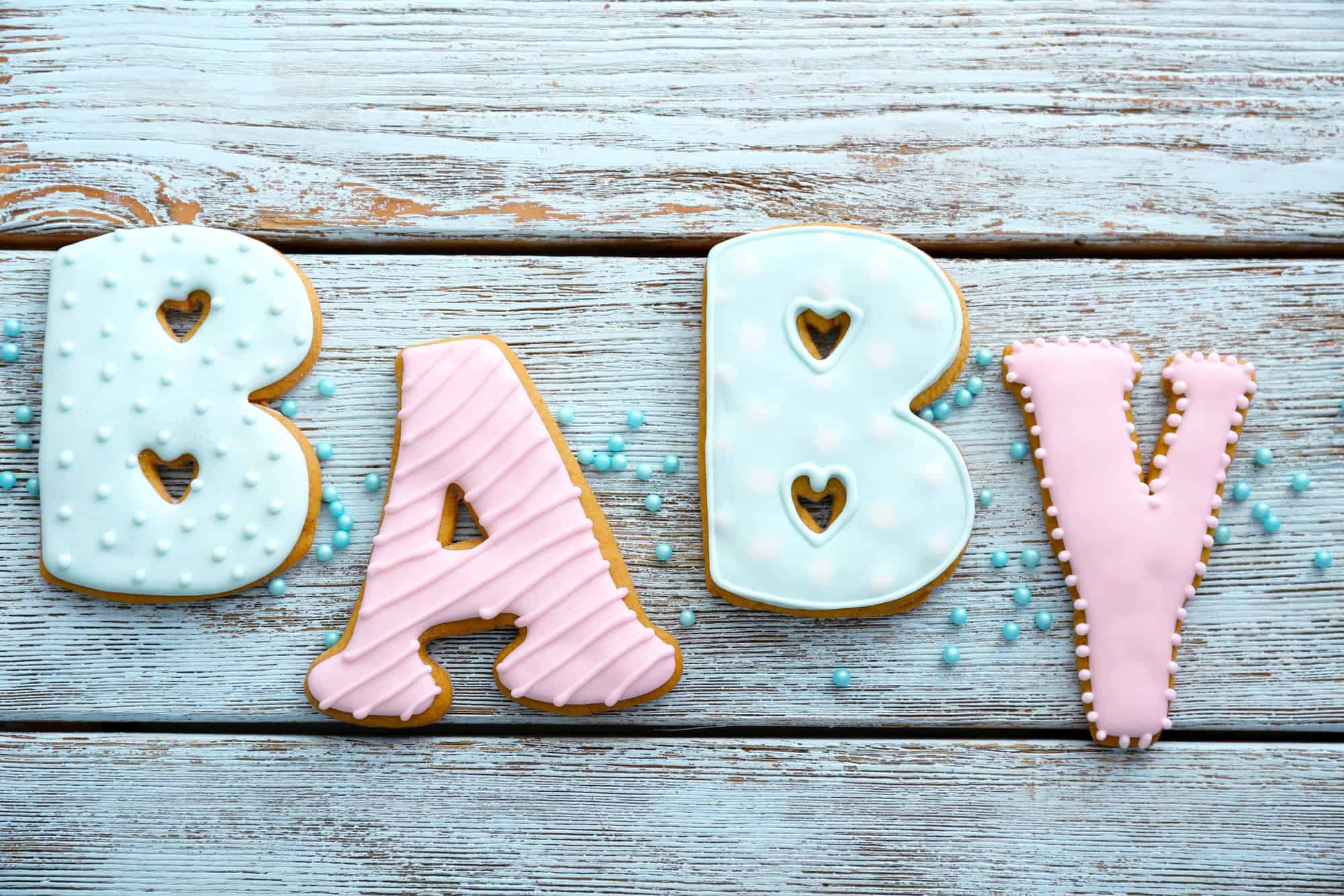 Baby shower cookies on wooden table